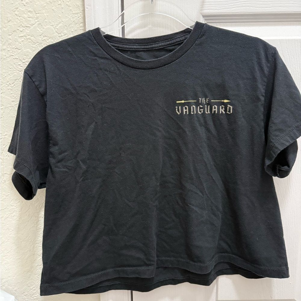 The Vanguard to the front black cropped tee